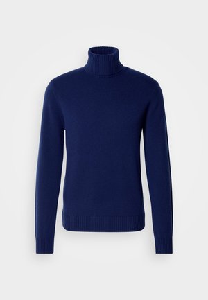 Sötétkék garbó pulóver, puha kötött anyagból készült. Bordás gallérral, ujjak végével és aljjal rendelkezik. Egyszerű, testhezálló kialakítás, látható minták nélkül.