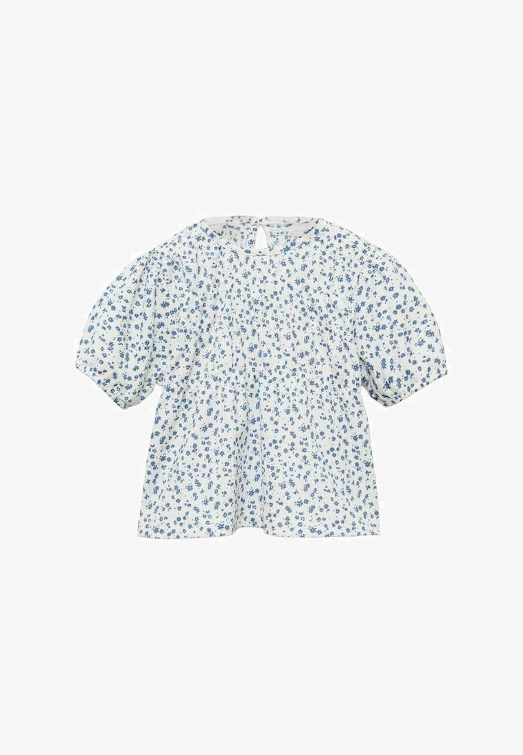 Blouse à imprimé floral avec des manches bouffantes courtes, fabriquée en tissu léger, présentant un fond blanc avec des fleurs bleues et une fermeture en keyhole au dos.