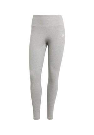 Leggings gris en tissu doux, avec une taille haute et un petit logo blanc sur la cuisse supérieure gauche. Design ajusté et élastique.