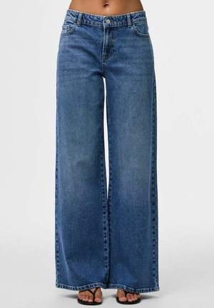 Wide-leg blue denim jeans with a high waist, featuring a classic five-pocket design and subtle fading. Textured fabric with a light wash.