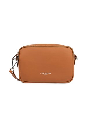 Brown leather crossbody bag with zipper closure, rectangular shape, and silver hardware. Features embossed logo on the front.