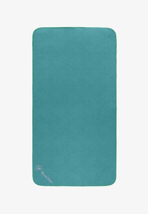 Turquoise yoga mat with a textured surface, rounded corners, and green accent trim. Notable branding detail in the corner.