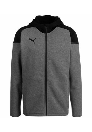 Grijze zip-up hoodie met zwarte accenten op de schouders, gemaakt van zacht materiaal, voorzien van een kangoeroezak en een logo op de borst.