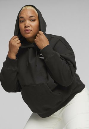 Sort hætte sweatshirt med en kengurulomme, ribbede manchetter og PUMA-logo på brystet. Har en afslappet pasform og blød tekstur.