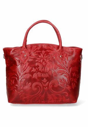 Sac à main en cuir rouge avec des motifs floraux embossés et deux poignées arrondies sur fond blanc.