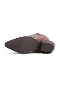 Red knee-high boot lying on its side showing a pointed toe and textured dark brown sole with a low block heel.