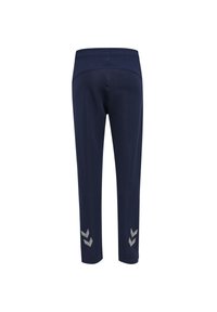 Marina atletiska byxor med en texturerad midja, avsmalnande design och reflekterande silverfärgade chevrontillbehör vid anklarna.