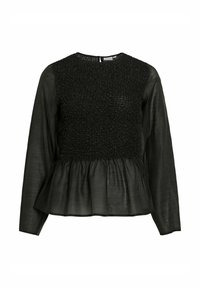 Top nero a maniche lunghe con corpetto arricciato e orlo a balze. Il tessuto ha una texture liscia, creando un aspetto stratificato.