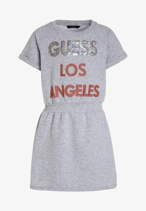 Graues Baumwollkleid mit kurzen Ärmeln. Mit glitzerndem „GUESS LOS ANGELES“-Logo in Pailletten, tailliert und im lässigen Design.