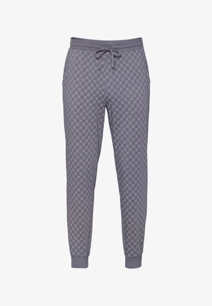 Grijze joggerbroek met een herhalend patroon van cirkelvormige kettingen, een elastische tailleband met aantrekkoord en geribbelde boorden bij de enkels.