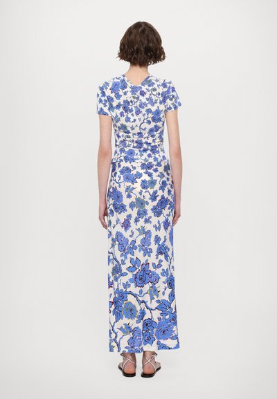 Maxi dress with short sleeves, white fabric adorned with blue floral pattern, fitted bodice, and slightly flared hem. Smooth texture.