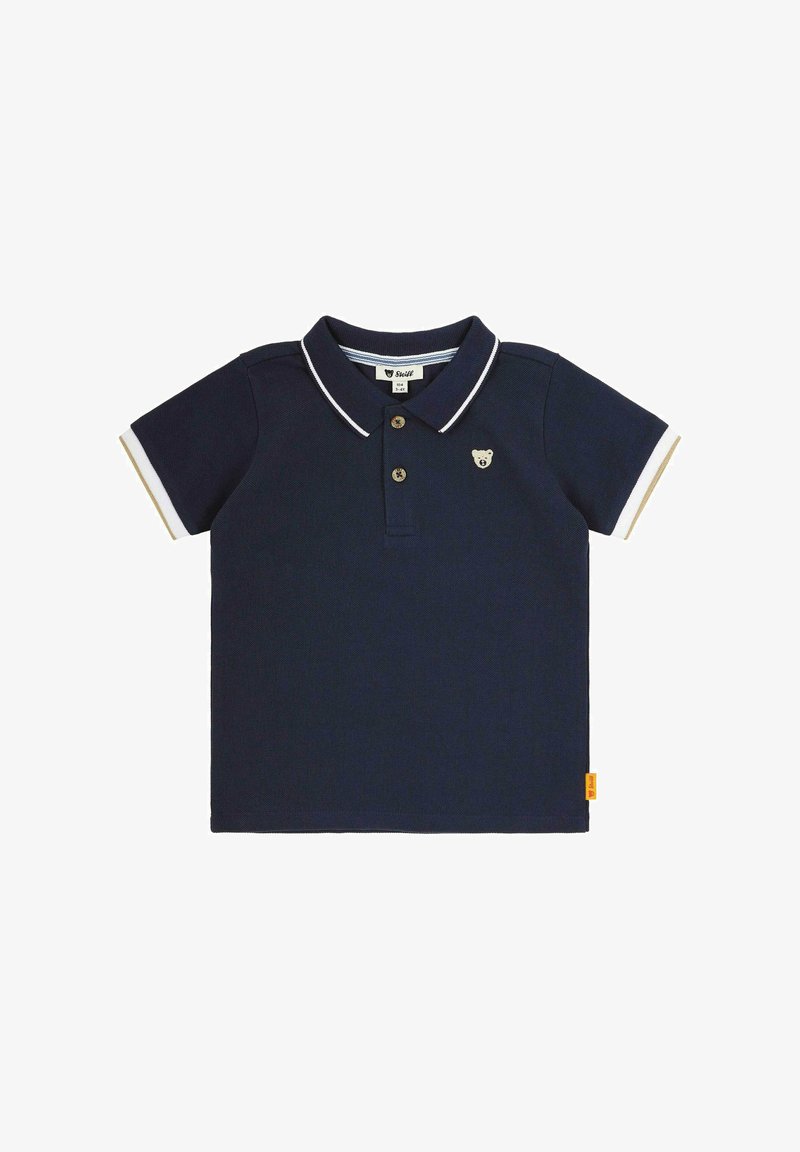 Námořnická modrá polo tričko vyrobené z texturované bavlny, s límečkem s bílým lemováním, dvěma knoflíky a logem medvěda na hrudi.