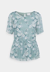 Květinový peplum top ze světle modré látky s krátkými rukávy, zdobený bílými květinami, zelenými akcenty a detaily s klíčovou dírkou na zadní straně.