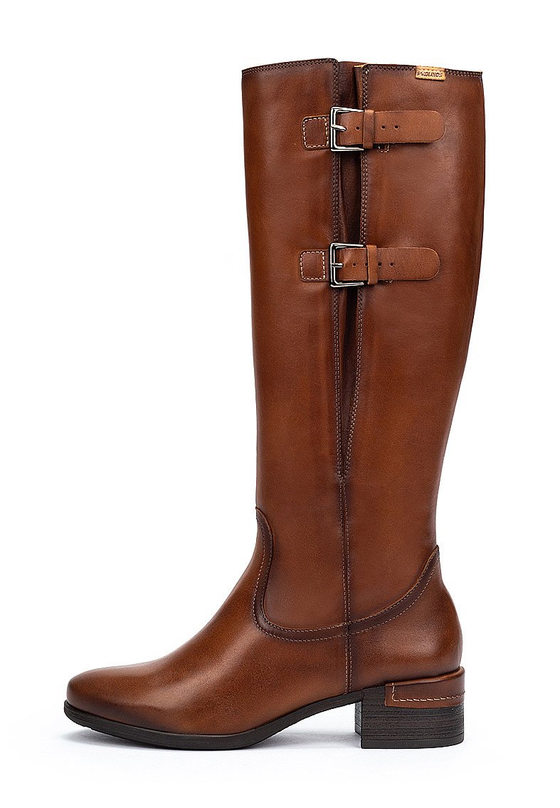 Bottine en cuir marron haute avec deux sangles ajustables à boucle et un petit talon empilé, présentée en profil droit sur fond blanc.