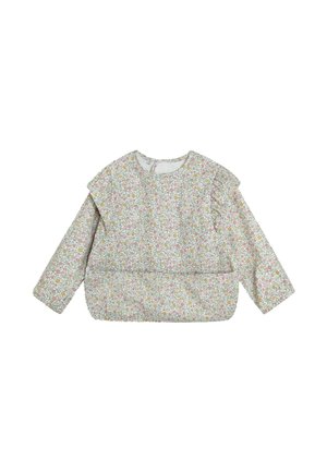 Bloemmotief blouse met lange mouwen, ronde hals en franje op de schouders. De stof is licht met een zachte textuur in pastelkleuren.