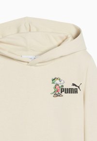 Felpa color crema con grafica di un gatto cartone animato e logo "PUMA" sul petto, dotata di cappuccio con cordino e texture morbida.