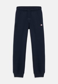 Pantalones de chándal azul marino con cinturilla elástica, cordón ajustable, tobillos ajustados y logotipo de Champion en el muslo izquierdo.