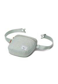 Borsa a tracolla quadrata di colore verde chiaro, realizzata in tessuto texture, con zip dorata e spallacci regolabili. Presenta un'etichetta con il logo del marchio.