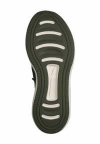 Sole of a black athletic shoe featuring textured green rubber with white horizontal grooves and a central logo accent.
