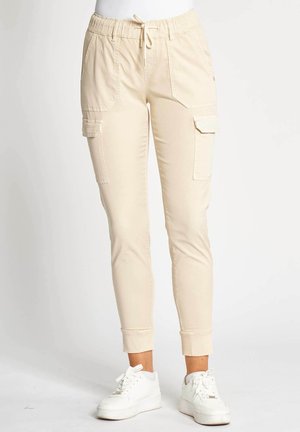 Beige Cargo-Jogginghosen mit elastischem Bund, Seitentaschen und gerippten Bündchen. Hergestellt aus leichtem Stoff mit glatter Textur.