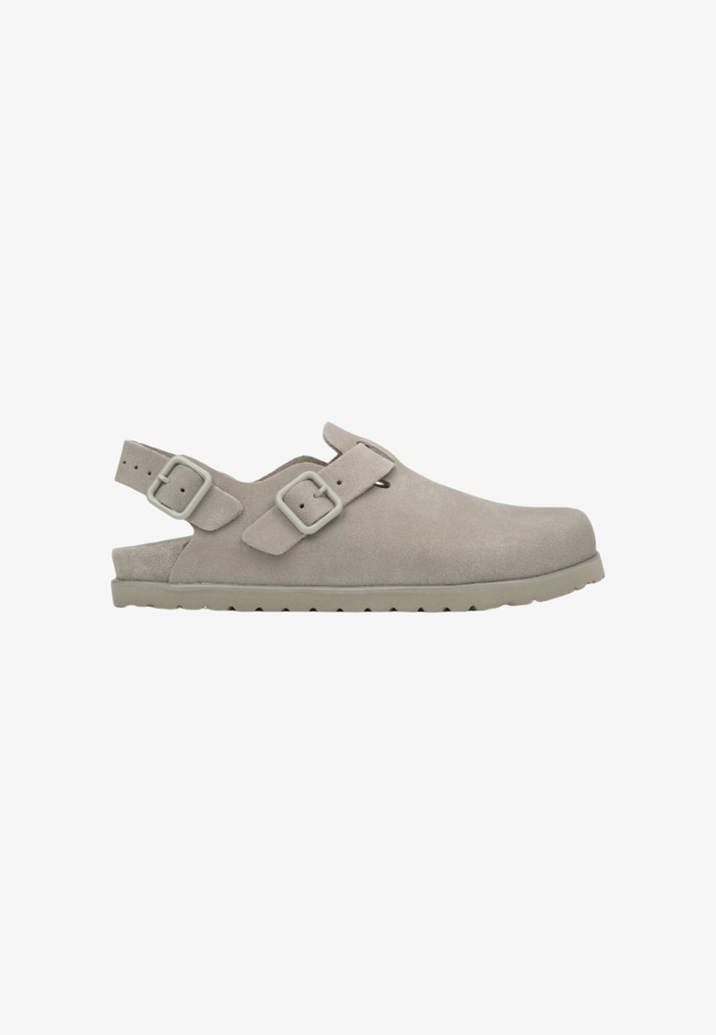 Gray suede clogs with an open back, featuring two adjustable straps with rectangular buckles and a textured rubber sole.