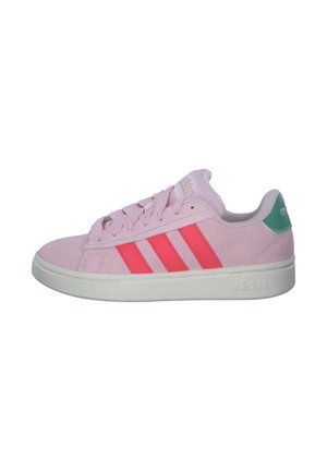 Pink suede sneaker with three bold red stripes, white sole, green heel accent, and matching laces. Round toe and low-top design.