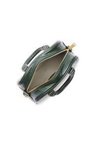 Green leather satchel with textured finish, gold zipper, and two handles. Interior shows plain fabric lining. Compact, rounded shape.