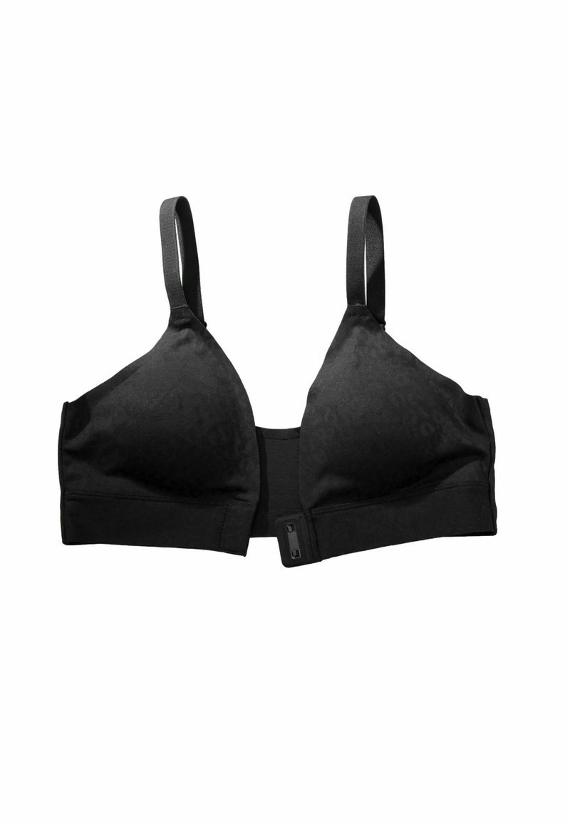 Must rinnahoidja sileda kangaga, valmistatud segakiududest. Kinnitatav haagi ja silmaga ning reguleeritavate rihmadega; tassis on õrn muster.