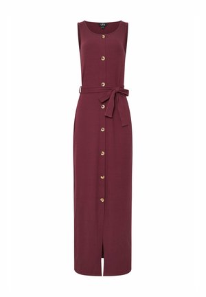 Burgundowa, bezrękawna sukienka maxi z zapięciem na guziki, odpinanym paskiem i bocznym rozcięciem. Wykonana z prążkowanej tkaniny z guzikami w złotym odcieniu.