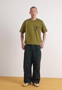 Carhartt WIP JUDD PANT - Trousers - black stone dyed