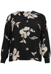 Svart långärmad blus med rund halsringning, prydd med stora krämfärgade blommönster och subtila röda detaljer. Tillverkad av lätt material.