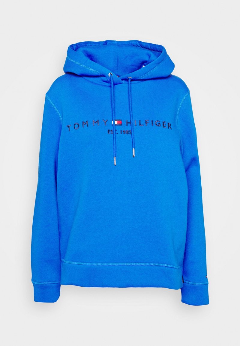 Blå hoodie i bomullsmix. Har snörning, ribbade ärmmuddar och broderad "TOMMY HILFIGER"-logotyp med etableringsår.