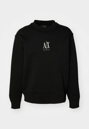 Black sweatshirt made of soft fabric, featuring a round neck, ribbed cuffs, and a white logo on the chest. Simple and unembellished design.