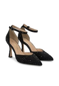 Escarpins noirs à talons hauts avec un bout pointu, en velours, ornés de perles. Comprend des bretelles à la cheville et un talon aiguille de 7 cm.
