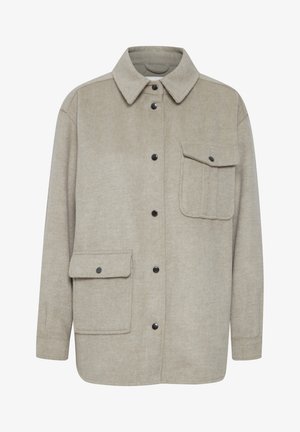 Helle beige Jacke aus strukturiertem Stoff, mit durchgeknöpftem Vorderteil, spitzem Kragen und einer Brusttasche mit Klappe.