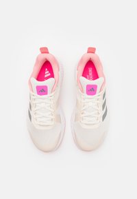 Lightweight athletic shoes featuring a breathable mesh upper in cream, pink accents, and grey stripes. Padded collar and rubber outsole.