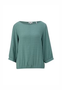 Blouse vert sarcelle avec manches 3/4, encolure ronde, tissu subtilement texturé, ourlet et poignets élastiqués.
