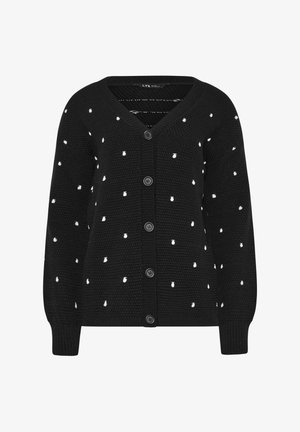 Sort strikket cardigan med hvide polkaprikker, V-hals, lange ærmer, ribstrikkede manchetter og fem knapper foran.