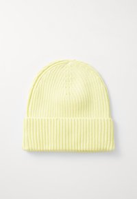 Light yellow ribbed knit beanie with a folded cuff, featuring a smooth texture and rounded top, designed for warmth and comfort.