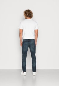 Jack & Jones JJIGLENN JJFOX - Calças de ganga de perna direita - grey denim
