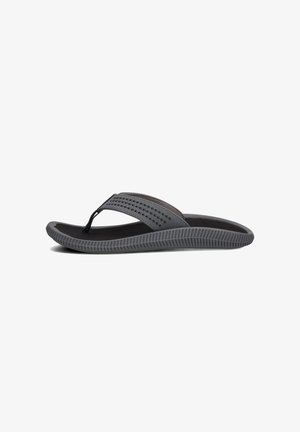 Tongs grises avec une semelle noire texturée, une fine lanière perforée et un design en caoutchouc flexible pour le confort et la facilité d'utilisation.