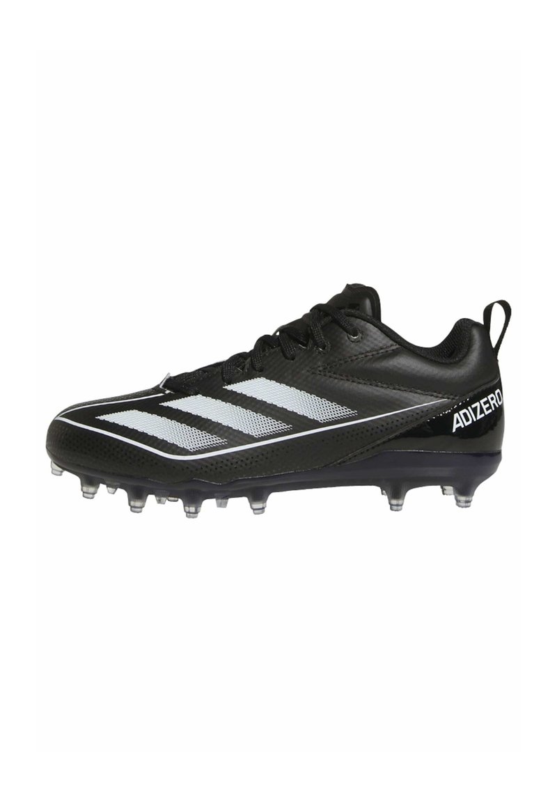 Scarpa da calcio nera con tomaia sintetica, dotata di tre strisce bianche, superficie texture e tacchetti trasparenti nella suola per una migliore aderenza.