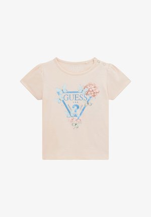 T-shirt rosa pallido a maniche corte con bottoni sulle spalle, caratterizzato da un logo triangolare blu e grafiche di farfalle floreali. Materiale in cotone morbido.