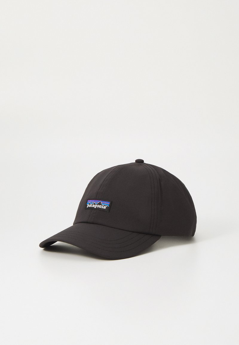 Black cap made of fabric with a curved brim, featuring a colorful Patagonia logo patch on the front. Simple design with visible stitching.