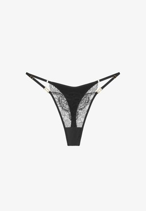 Mustat pitsiset alushousut, joissa on herkkiä kukkakuoseja, säädettävät hihnat, kultaiset yksityiskohtaiset varusteet ja erottuva kiinteä kangas edessä.