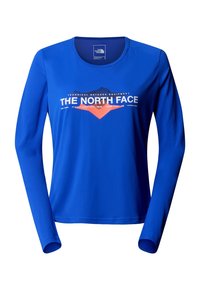 Modrá dámská košile s dlouhým rukávem se znakem "The North Face", grafikou hory a textem o venkovním vybavení na hrudi.