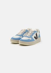 Blue and white sneakers with perforated design, suede accents, beige rubber sole, and black logo details on the sides.