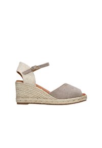 Tan suede wedge sandal with a braided jute sole, open toe, and ankle strap. Textured fabric on the strap creates contrast. Buckle detail included.