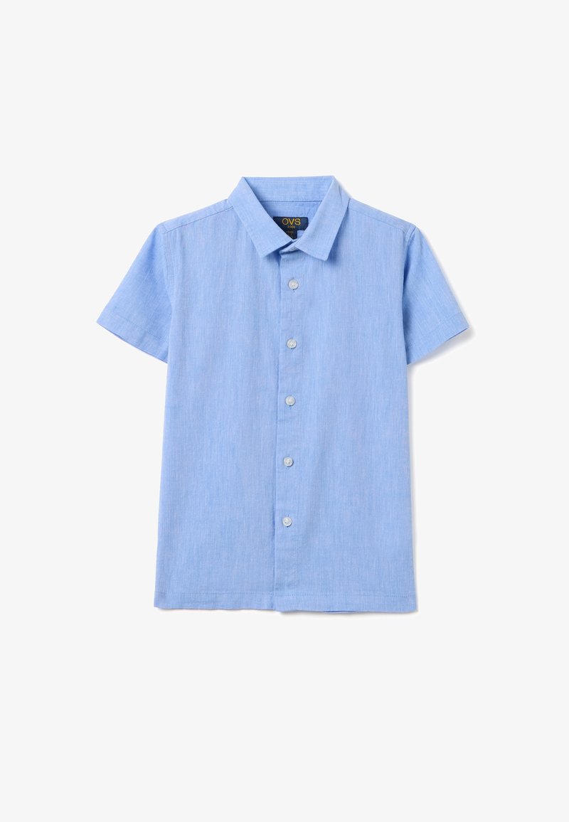 Camicetta azzurra chiara a maniche corte con bottoni in un tessuto texturizzato, orlo dritto e colletto classico, caratterizzata da sei bottoni sulla parte anteriore.