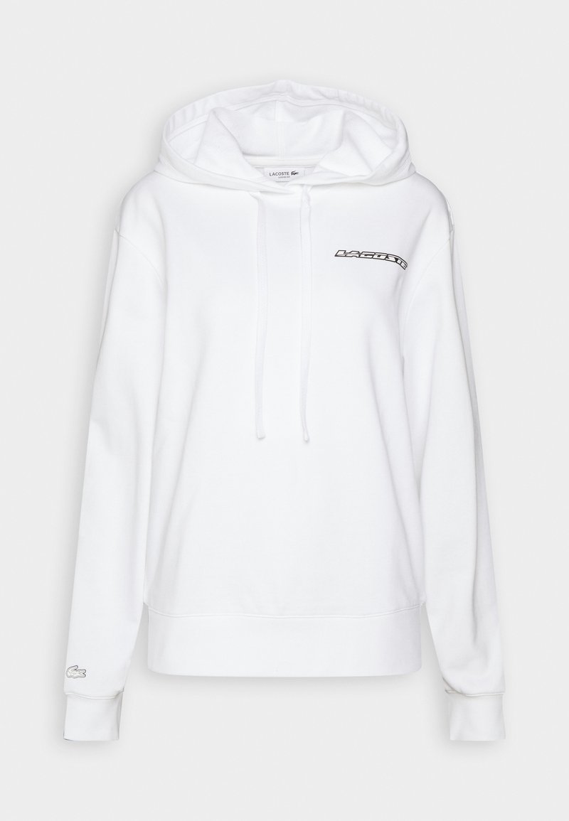 Biała bluza z kapturem z dostosowywanymi trokami, z czarnym logo "LACOSTE" na klatce piersiowej oraz subtelnym logo na lewym rękawie. Miękka tkanina.